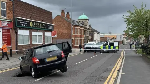 Sean Turley Sink hole car