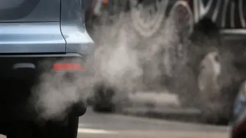 Getty Images exhaust fumes from car