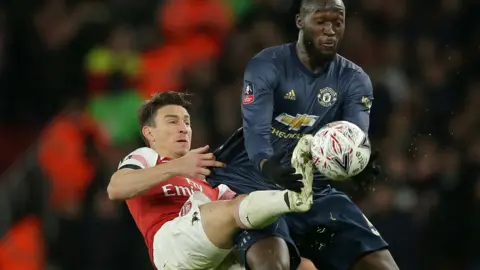 Laurent Koscielny tangles with Romelu Lukaku