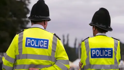 Getty Images Police in hi-vis jackets