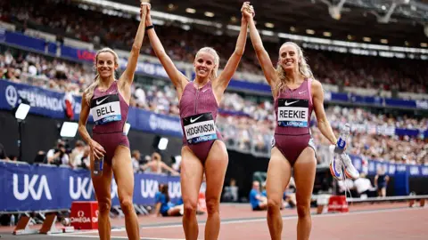 AFP/Getty Images Britain's Keely Hodgkinson celebrates with Britain's Georgia Hunter-Bell and Britain's Jemma Reekie after the Women's 800m 