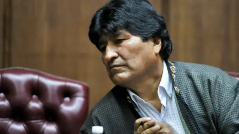 AFP Bolivia's exiled ex-President Evo Morales gestures as he delivers a speech at the Mexican Journalists Club, in Mexico City