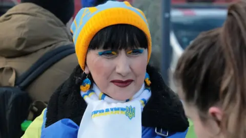 Getty Images Ukrainian woman with patriotic blue and yellow eye shadow