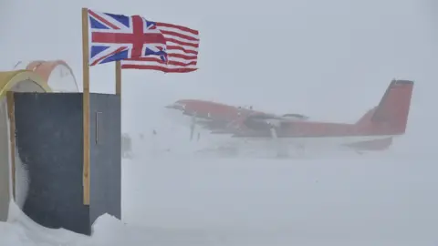 BBC Plane seen through a blizzard on the ground