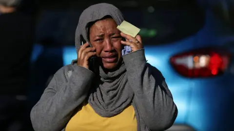 AFP/Getty Woman crying