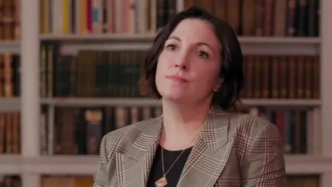 BBC Helen MacNamara head and shoulders portrait, she's wearing a blazer and has brown hair