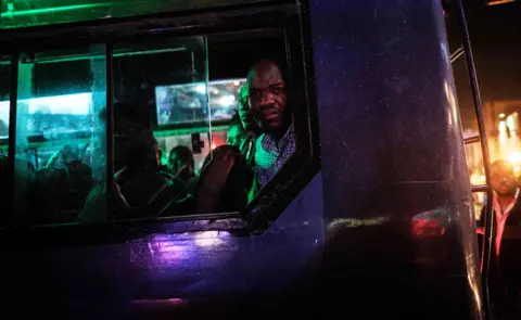 Getty Images Passengers on a bus, a male passenger has a shocked look on his face - Saturday 26 January