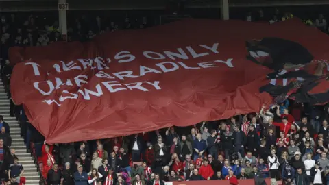 Reuters Sunderland fans held up a banner of support for Bradley