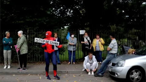 Reuters Protesters gather outside the gates of Walleys Quarry landfill in Silverdale