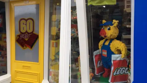 Virginia Pope The front of Osborne's toy shop in Rushden, covered in Lego bricks.
