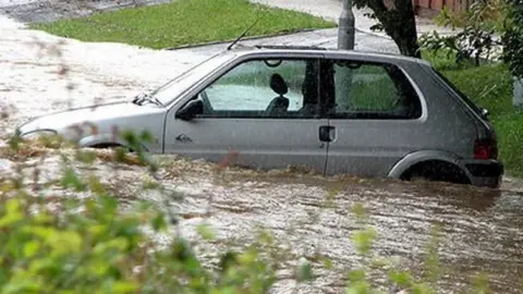 Other A car in flood water outside the Kennet School in Thatcham in 2007