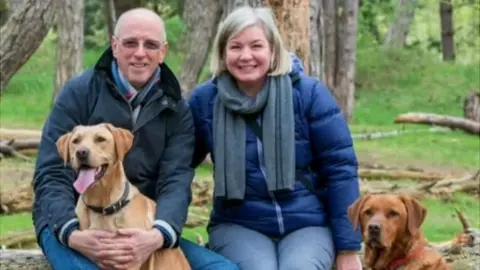 Ellis family Richard and Lesley Ellis with their dogs