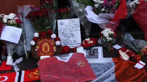 Paul Ellis Getty Tributes outside Old Trafford