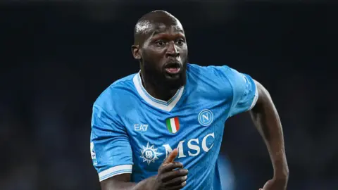 Romelu Lukaku running in a light blue Napoli shirt