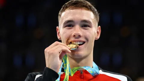 Reuters Ioan Croft with his welterweight boxing gold