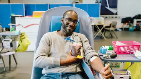 NHSBT A man donating blood at a session in Croydon, south London