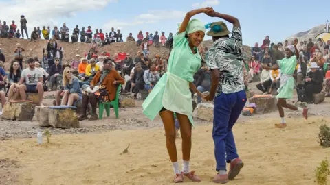 Jeffrey Abrahams/Getty Images Rieldan dancers performing at a jazz festival in an disused quarry outside Prince Albert in South Africa - Friday 5 May 2023