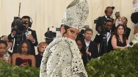 Getty Images Rihanna on the red carpet of the Met gala ball