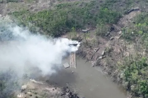 Reuters Photo showing destroyed pontoon bridge