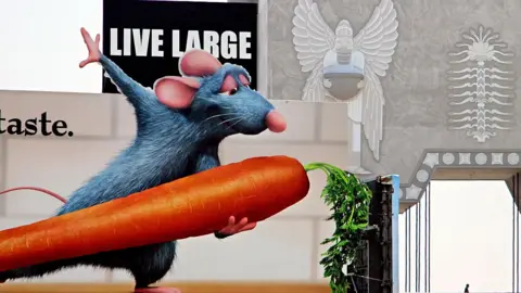 Getty Images Character of Remy in Ratatouille holding a carrot