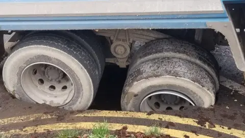 Melanie Ritchie The lorry's wheels in the hole