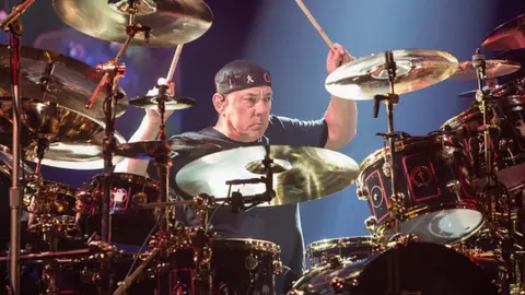 Getty Images Neil Peart, the drummer and lyricist for rock band Rush