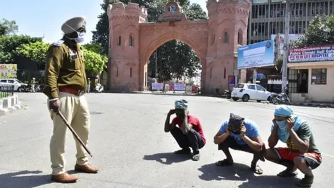 Getty Images police enforcing curfew in Punjab