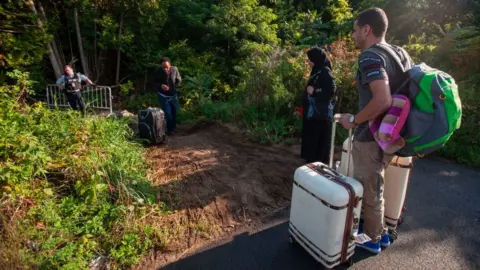 Getty Images Migrants crossing at Roxham Road