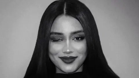 Ghazal Ranjkesh A black and white photo of Ghazel Ranjkesh with her right eye injured