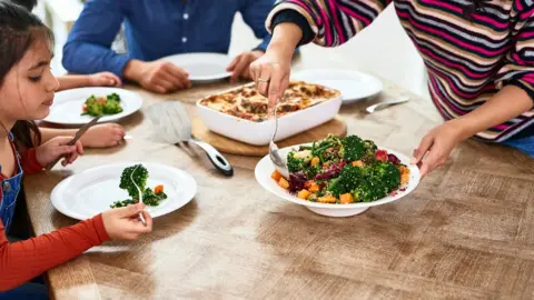 Getty Images File picture of family eating a meal