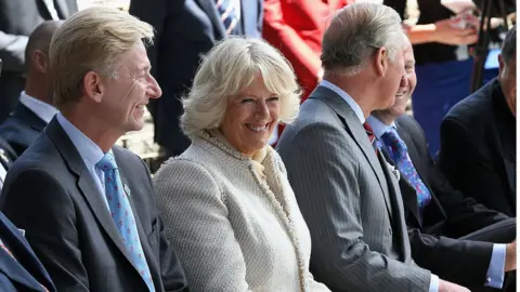 Getty Images Clive Alderton with the Duchess of Cornwall and Duke of Wales