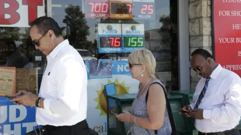 EPA People wait outside a liquor store to buy lottery tickets in Hawthorne, California