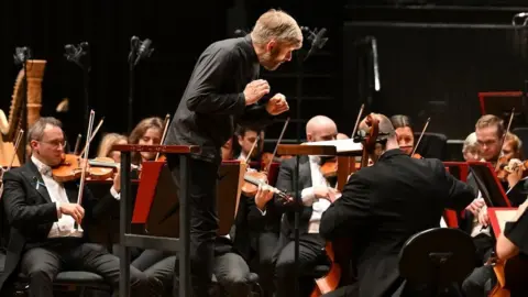 Mark Allan Kirill Karabits conducting an orchestra