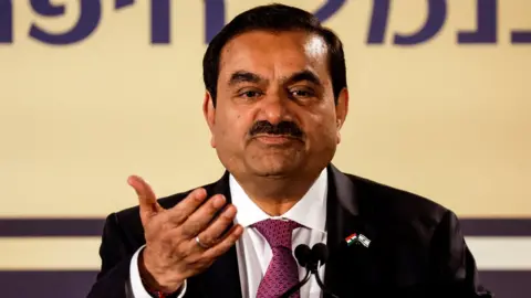 Reuters Indian billionaire Gautam Adani speaks during an inauguration ceremony after the Adani Group completed the purchase of Haifa Port in January 2023.