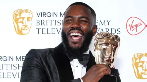 PA Media Mo Gilligan with his Bafta Award