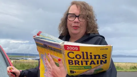 BBC Hayley Green holding road atlas