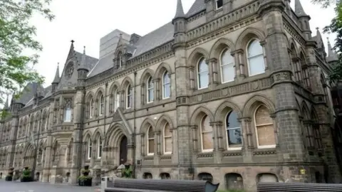 A two-storey sandstone building, the home of Middlesbrough Council, dating from the 1880s. It has a pitched slate roof, turrets, high arched windows and engravings between storeys.