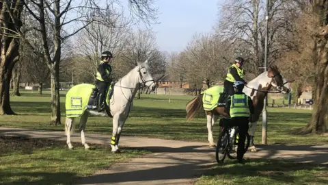 BBC police on horses and bicycle on patrol in Cardiff