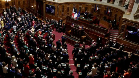 Reuters King Charles is applauded by members of parliament after he delivered his speech at the French Senate in Paris