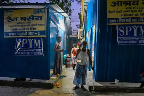 Getty Images Homeless people seen staying inside a night shelter amid extreme hot weather conditions at Lodhi Road on June 18, 2024 in New Delhi,