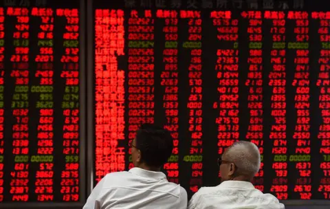 AFP/Getty Images Investors monitor stock price movements at a securities company in Beijing on 15 June 2016