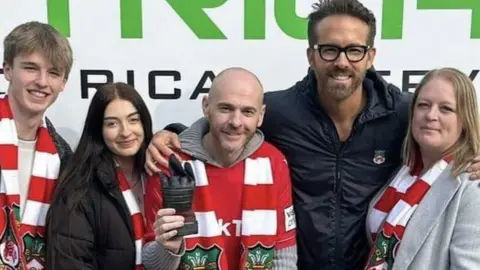 Family Photo Ryan Reynolds posed for photographs with Jay and his wife Deb, son Sam, 16, and daughter Jess, 18