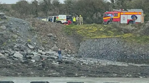 HM Coastguard Padstow Fire engine on the shore