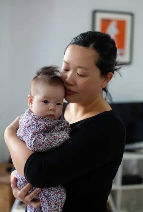 Nina Raingold A portrait of Amy with her baby daughter Elowen