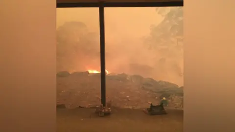 Gabriel Kam fire outside Gabriel's home, before it was destroyed