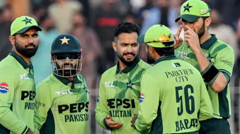 Pakistan's players celebrate taking a wicket against South Africa during a one-day international in November 2025