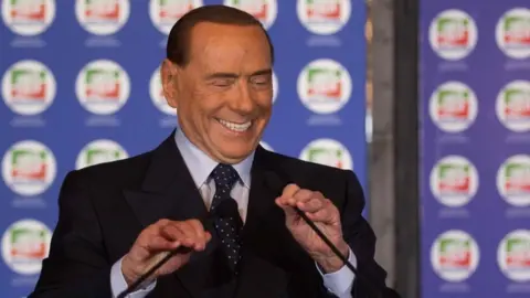AFP Silvio Berlusconi pictured speaking at his party convention in October 2017