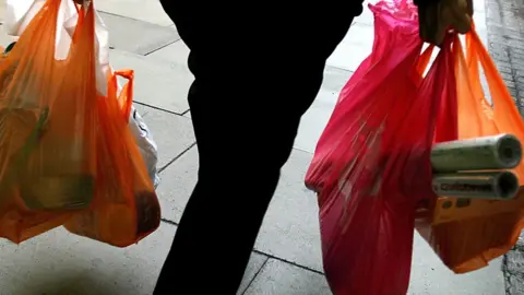 EPA Shopper holding two plastic bags