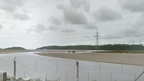 Google Pylon on the Dwyryd estuary with the rail line in the foreground