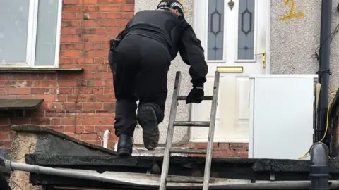Northamptonshire Police Officers carrying out searches